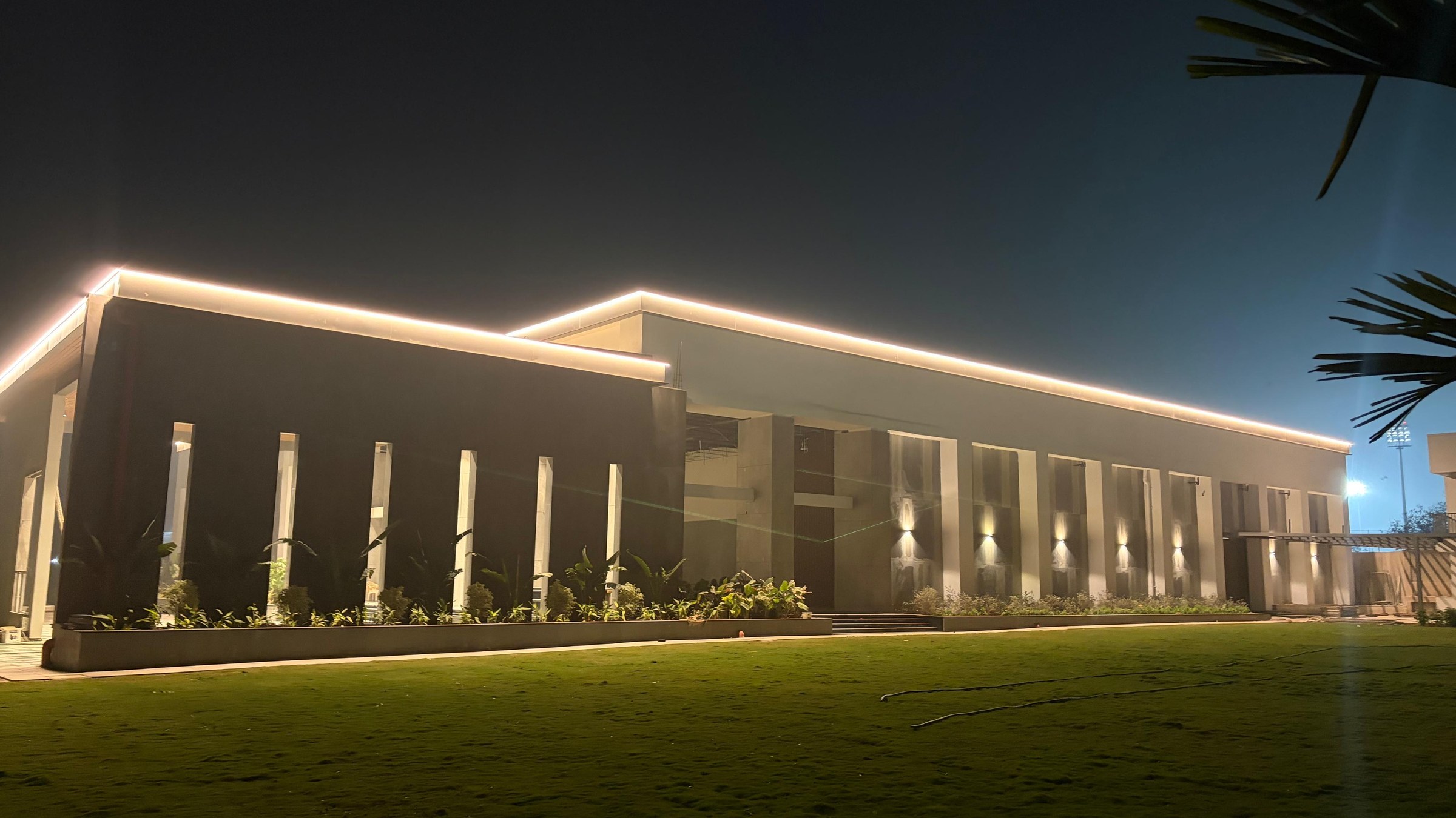Warm illuminated exterior facade of Samruddhi